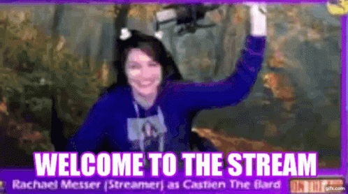 Woman in Blue Sweater in Front of Welcome to the Stream Sign