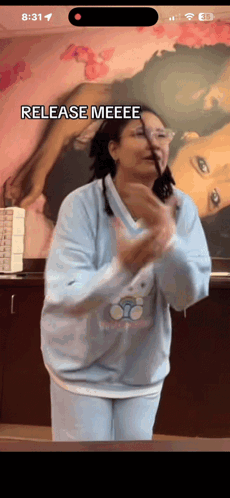 Woman in Blue Sweater Says Release Meeee