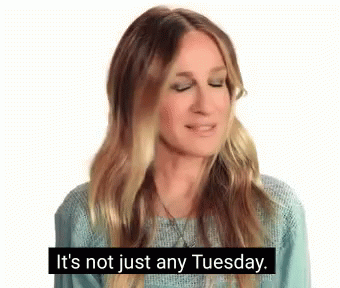 Woman in Blue Sweater Talking About Tuesday