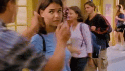 Woman In Blue Talking To Man In Plaid GIF