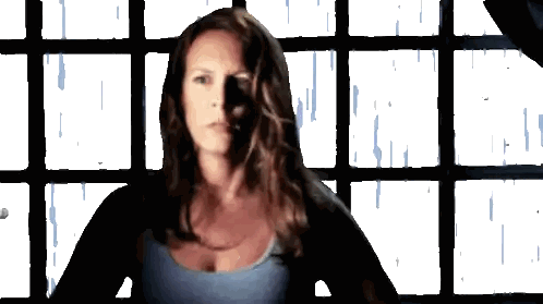 Woman in Blue Tank Top by Window