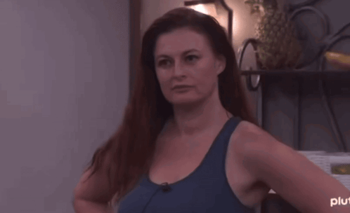 Woman In Blue Tank Top Hands On Hips GIF