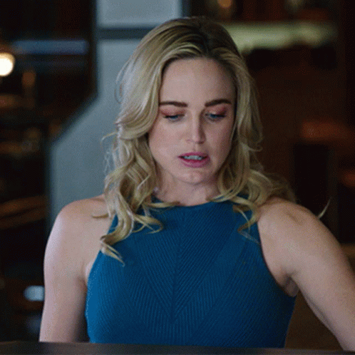 Woman In Blue Tank Top Looking Down GIF