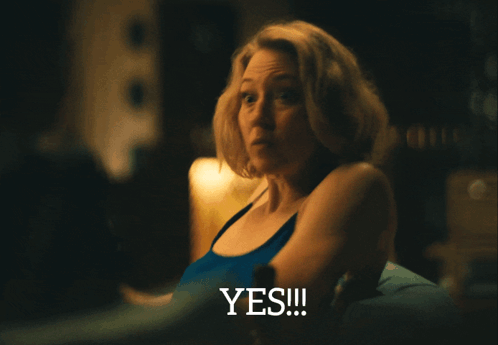 Woman in Blue Tank Top Saying Yes