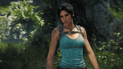 Woman in Blue Tank Top Standing in Forest