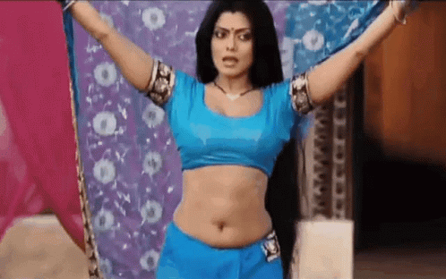 Woman in Blue Top and Shorts Dancing