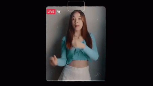Woman in Blue Top and White Skirt Singing Live