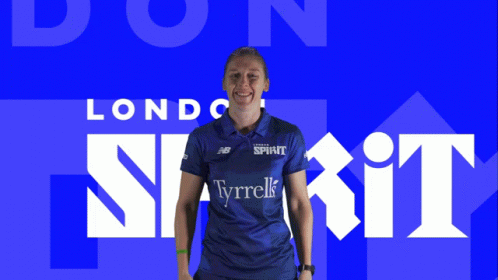 Woman in Blue Tyrrells Shirt