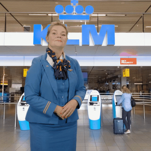 Woman in Blue Uniform at Sky Priority Sign