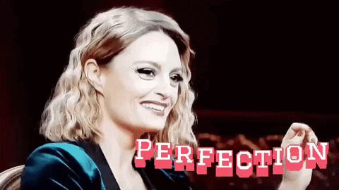 Woman In Blue Velvet Jacket Smiling With Perfection GIF