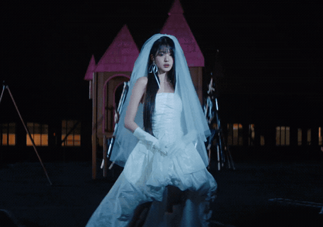 Woman In Bride Dress In Front Of Fire GIF