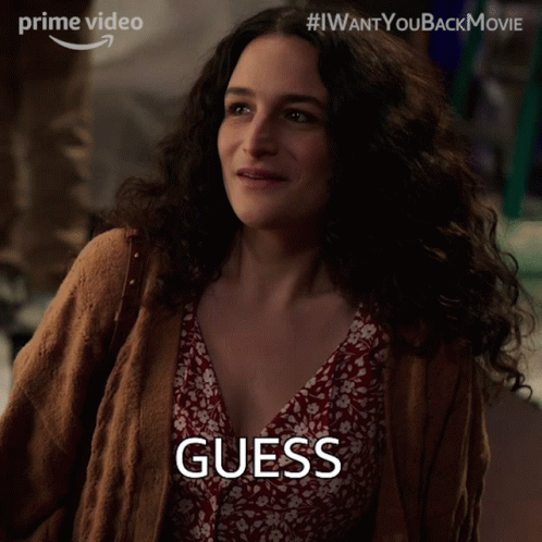 Woman in Brown Cardigan Red Floral Dress Saying Guess