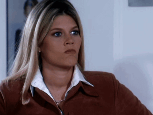 Woman in Brown Jacket and White Shirt