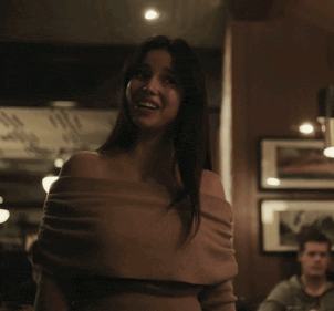 Woman In Brown Off-Shoulder Top Crying In Dark Room GIF