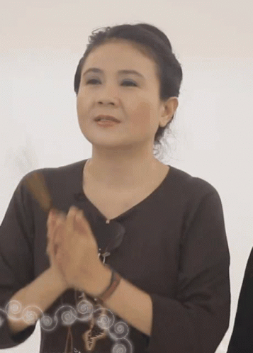 Woman In Brown Shirt Clapping GIF