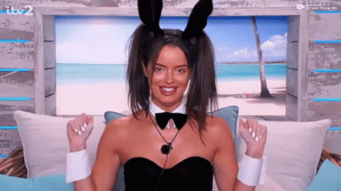 Woman in Bunny Ears and Bow Tie on Couch