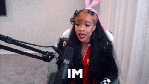 Woman In Bunny Ears At Microphone Saying Im GIF