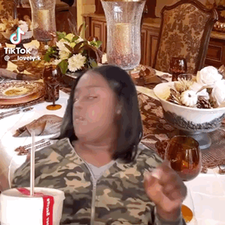 Woman In Camouflage Jacket Holding Chicken Cup GIF