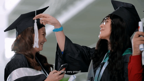 Woman In Cap And Gown Says Proud GIF