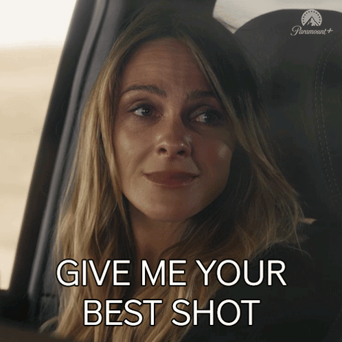 Woman in Car Give Me Your Best Shot