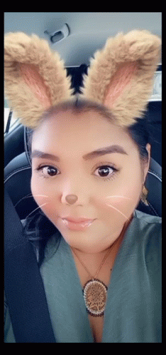 Woman in Car with Bunny Ears and Necklace