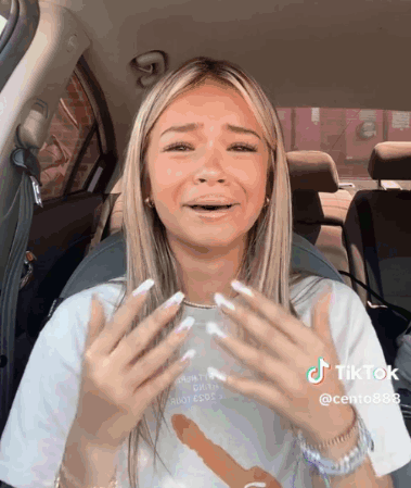 Woman in Car With TikTok Sticker