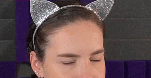 Woman in Cat Ear Headband Making Funny Face