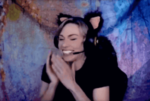Woman in Cat Ear Headset Smiling and Clapping