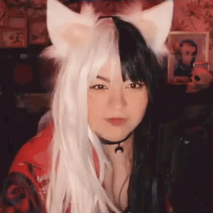 Woman in Cat Ear Wig and Choker at Microphone