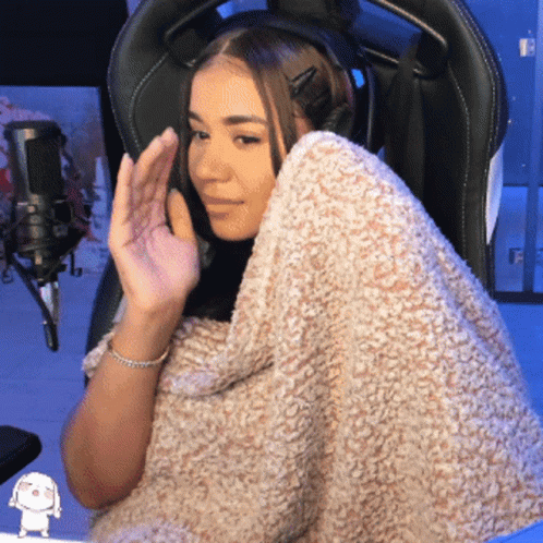 Woman In Chair With Blanket Around Shoulders GIF