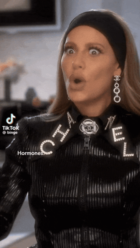Woman in Chanel Jacket and Earrings