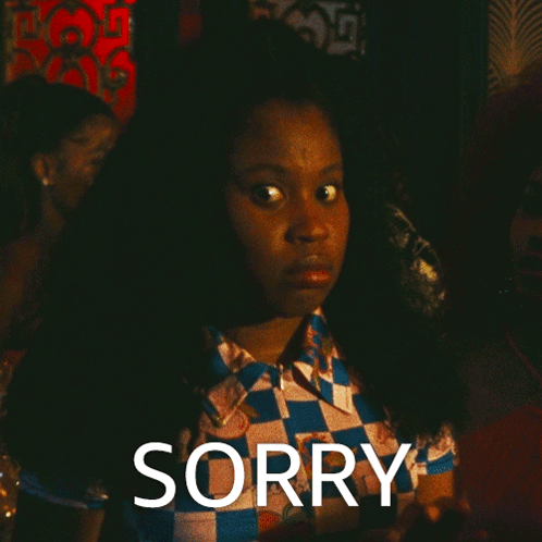 Woman In Checkered Shirt Saying Sorry GIF