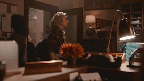 Woman In Choker And Plaid Shirt Standing Next To Woman GIF