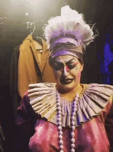 Woman in Clown Costume with Large Collar and Pearls