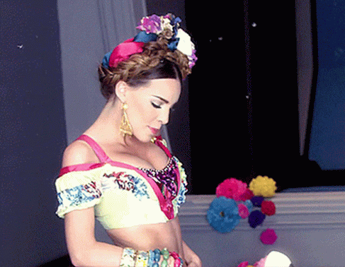 Woman in Colorful Crop Top and Earrings