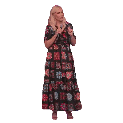 Woman in Colorful Dress Holding Microphone