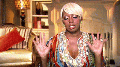 Woman In Colorful Dress Standing With Outstretched Hands GIF