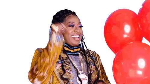 Woman in Colorful Jacket Holding Red Balloons