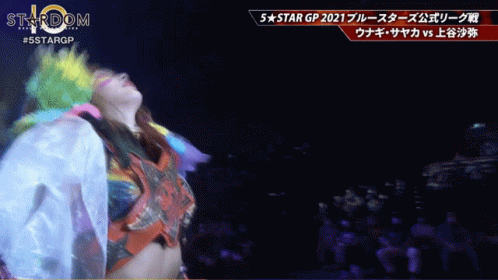 Woman in Colorful Outfit Dancing at 5 Star GP Sign