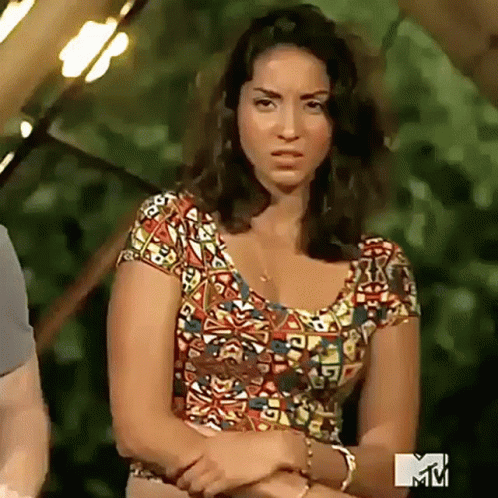 Woman In Colorful Shirt In Front Of MTV Sign GIF