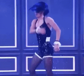 Woman In Corset And Shorts Dancing On Stage GIF