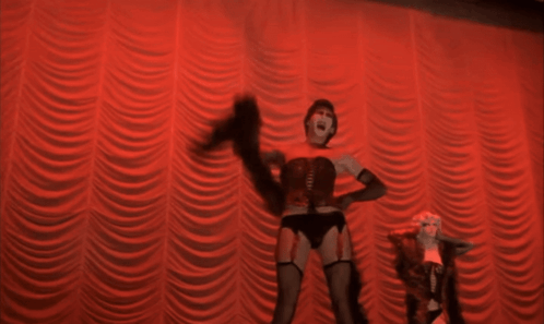 Woman in Corset Dancing on Stage