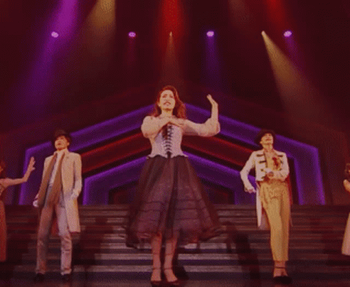 Woman In Corset Dancing With Two Others GIF