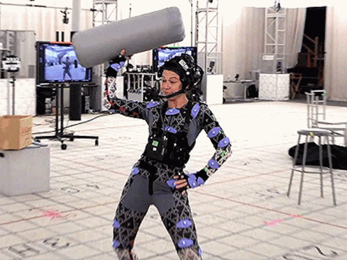 Woman in Costume Holding Microphone with E Helmet