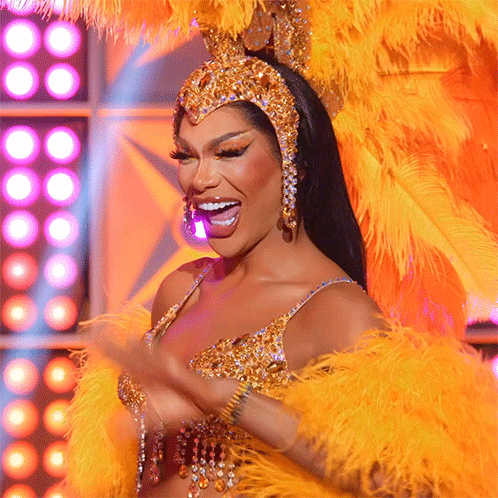 Woman in Costume With Feathers and Rhinestones Smiling