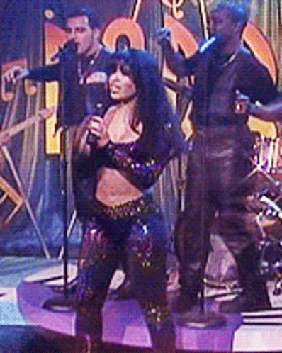 Woman in Cow Print Crop Top Dancing on Stage