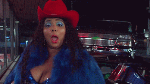 Woman in Cowboy Hat and Blue Fur Coat