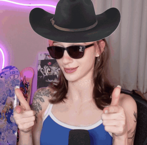 Woman in Cowboy Hat and Sunglasses Thumbs Up