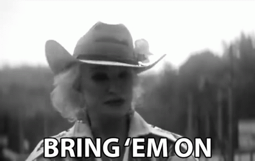 Woman in Cowboy Hat Saying Bring Em On