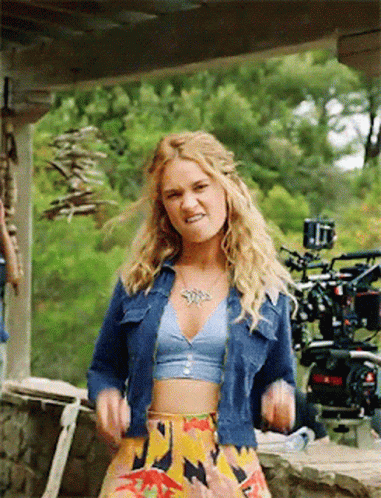 Woman in Crop Top and Denim Jacket